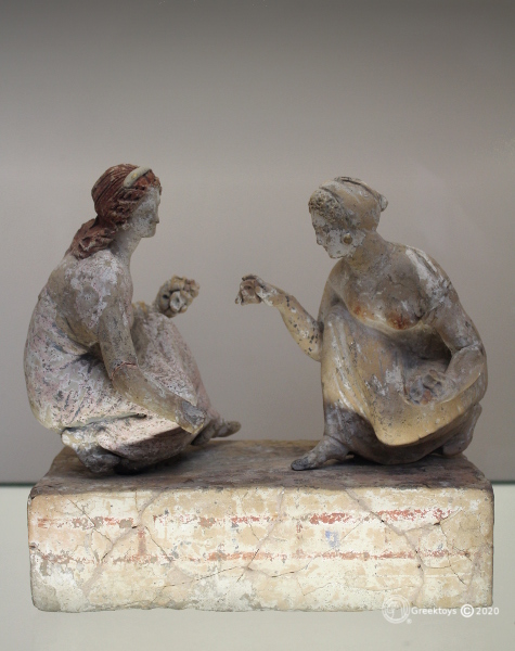 Girls playing knucklebones